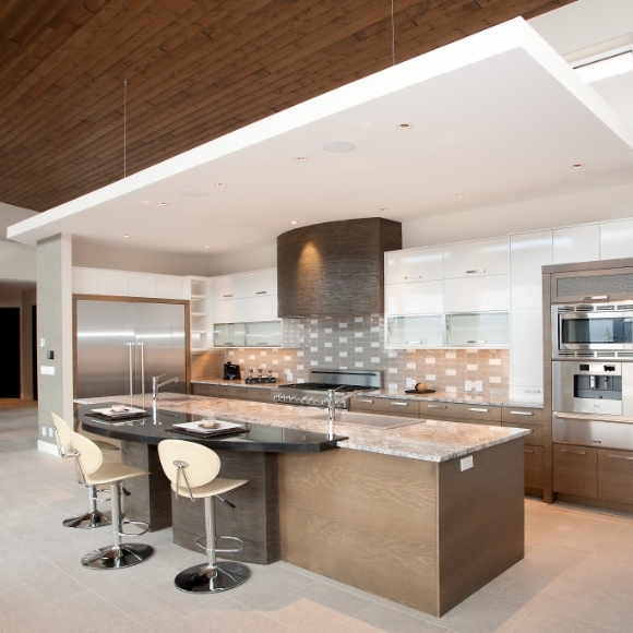 Kitchen with custom white and gray wood cabinets